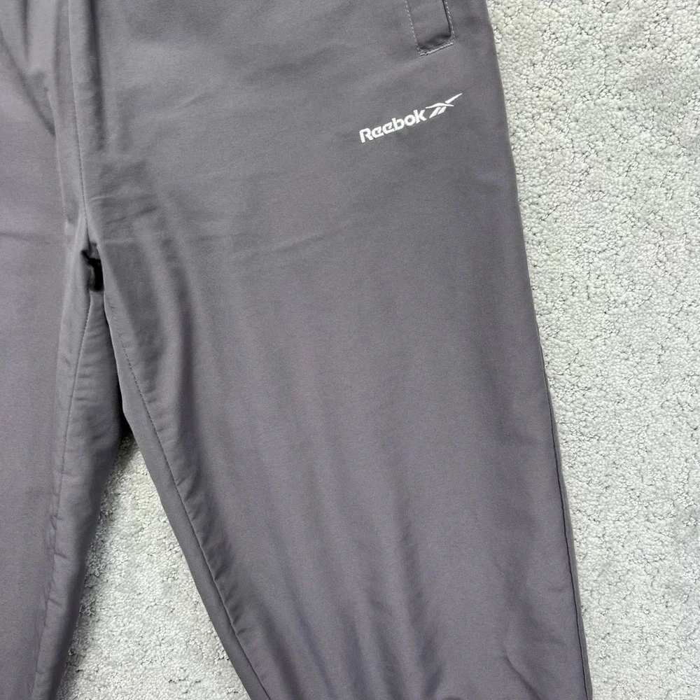 VINTAGE 90s Reebok Track Pants Womens Small Grey Faded Tapered Lined Ankle Zip